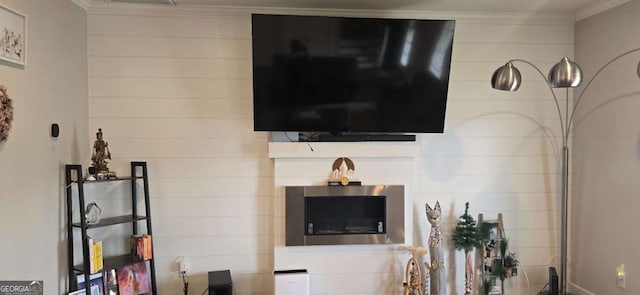 living room with ornamental molding
