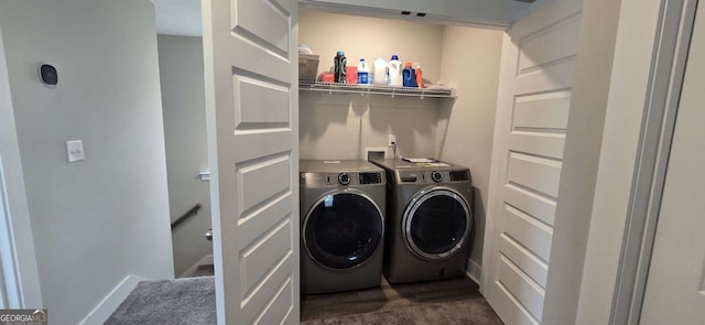laundry room featuring washer and dryer and dark colored carpet