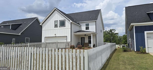view of front of property featuring board and batten siding, a garage, and ceiling fan
