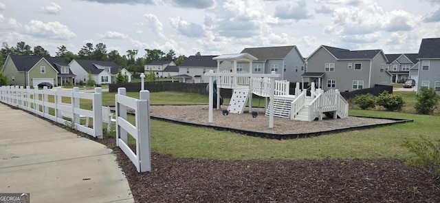 community jungle gym with a residential view