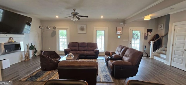 living area featuring a ceiling fan, dark wood finished floors, stairway, recessed lighting, and crown molding