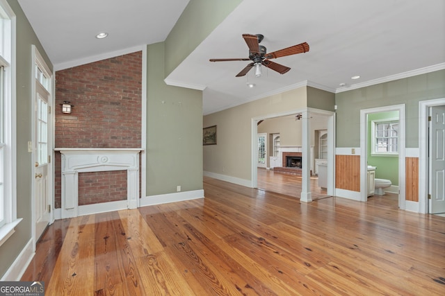 5695 Sweetbriar Trl, Macon, GA 31210 - unfurnished living room with a fireplace, ceiling fan, wood finished floors, healthy amount of natural light, and ornamental molding