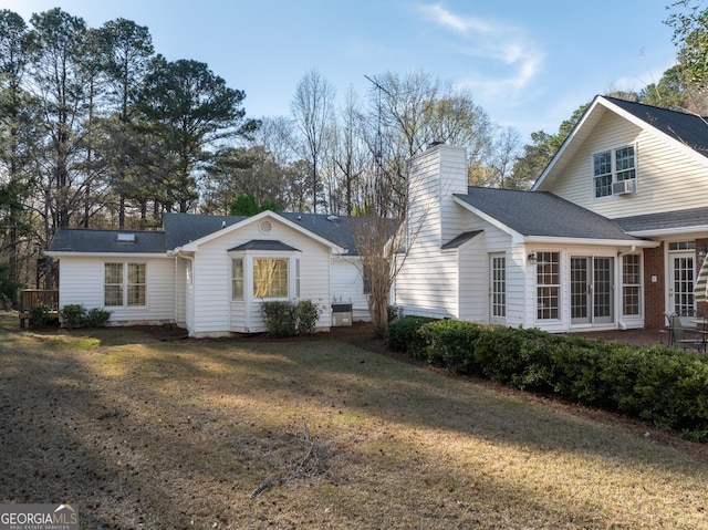 5695 Sweetbriar Trl, Macon, GA 31210 - view of home's exterior with a chimney and a yard