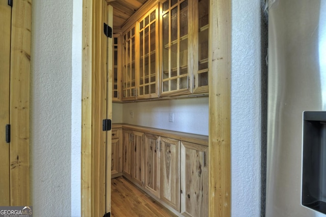 detailed view of a textured wall and wood finished floors