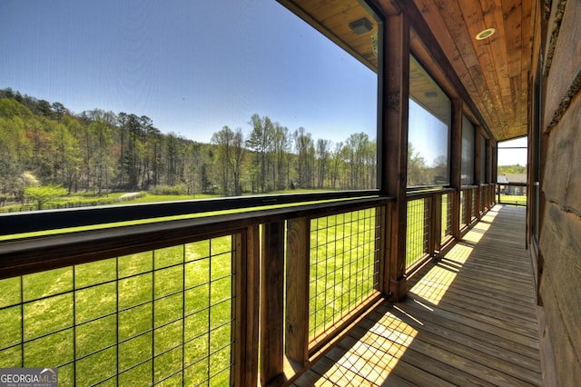 wooden terrace with a forest view