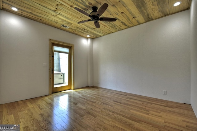 empty room with wood ceiling, a ceiling fan, wood finished floors, and recessed lighting