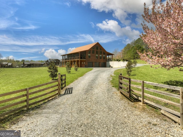 view of dirt / gravel road with a gated entry