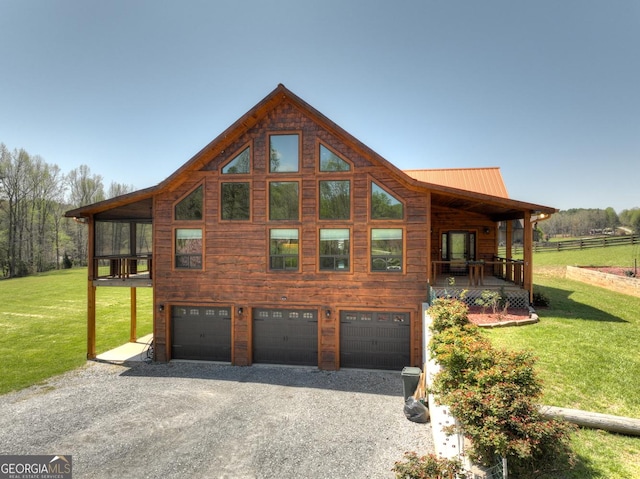 view of side of property featuring a garage, driveway, and a yard