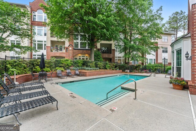 3636 Habersham Rd NW Unit 2101, Atlanta, GA 30305 - community pool featuring a patio area