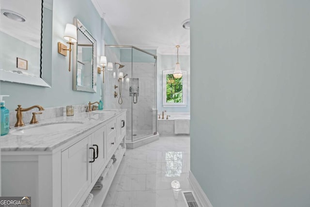 bathroom featuring marble finish flooring, a shower stall, a bath, and double vanity