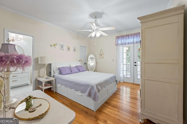 bedroom with crown molding, light wood-style floors, and a ceiling fan
