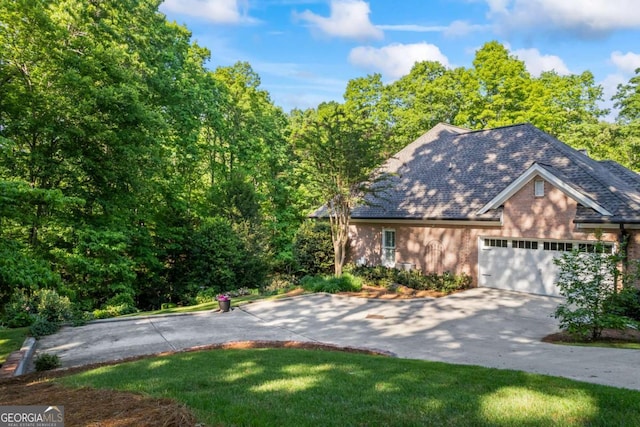 view of front of house featuring asphalt driveway and an attached garage