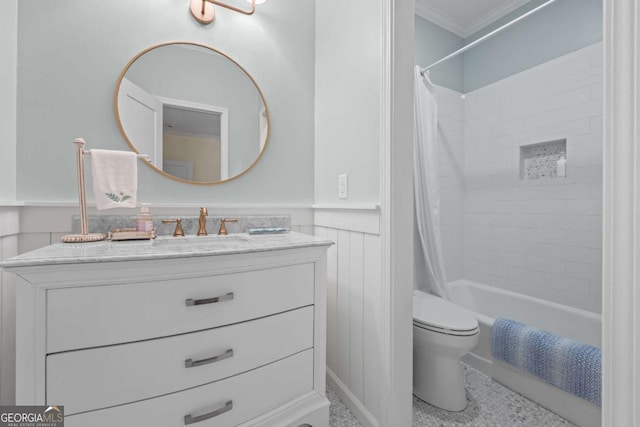 bathroom with crown molding, a wainscoted wall, toilet, vanity, and shower / bathtub combination with curtain