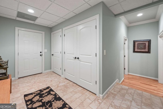 foyer entrance with baseboards, recessed lighting, and light stone finish flooring