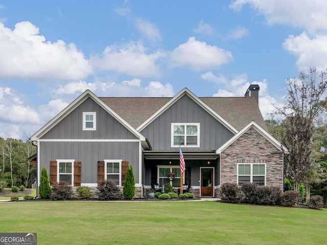 111 Walnut Ln, Williamson, GA 30292 - craftsman-style house featuring a porch, a shingled roof, stone siding, and a front lawn