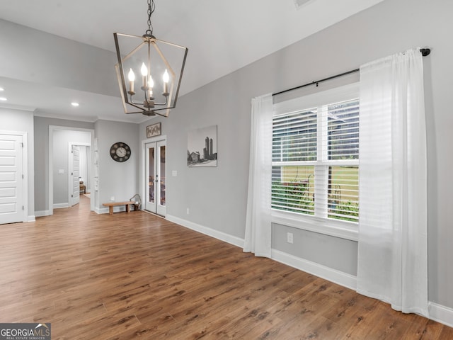 111 Walnut Ln, Williamson, GA 30292 - unfurnished dining area featuring baseboards, french doors, wood finished floors, a chandelier, and recessed lighting