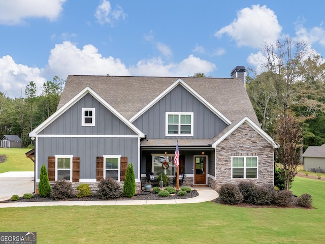 111 Walnut Ln, Williamson, GA 30292 - craftsman-style house featuring a shingled roof, board and batten siding, covered porch, stone siding, and a front yard