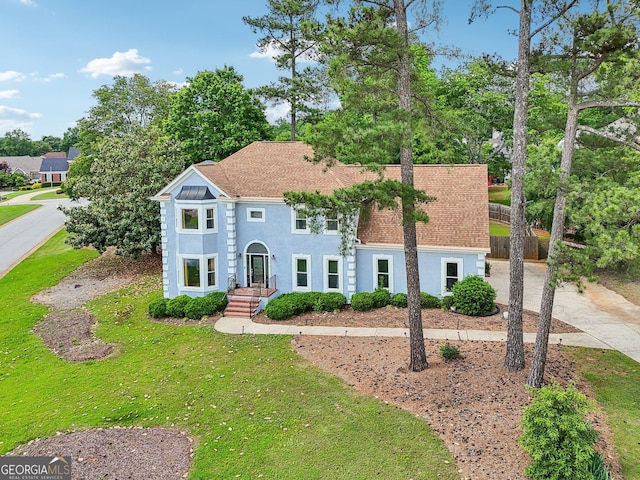 771 James Cir, Lawrenceville, GA 30046 - view of front facade with stucco siding, driveway, and roof with shingles