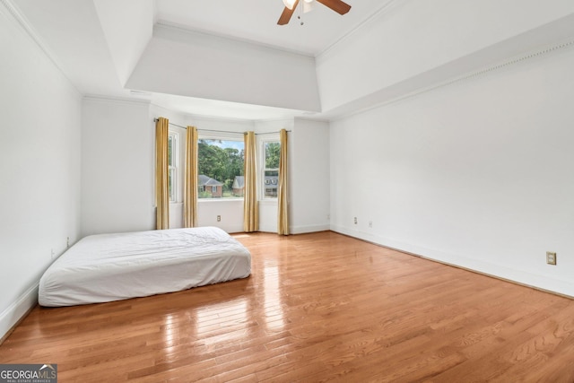 771 James Cir, Lawrenceville, GA 30046 - bedroom with light wood finished floors, baseboards, ornamental molding, and ceiling fan