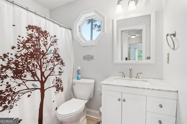 771 James Cir, Lawrenceville, GA 30046 - bathroom featuring toilet, plenty of natural light, baseboards, and vanity