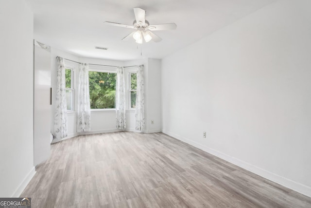 771 James Cir, Lawrenceville, GA 30046 - empty room with a ceiling fan, wood finished floors, and baseboards