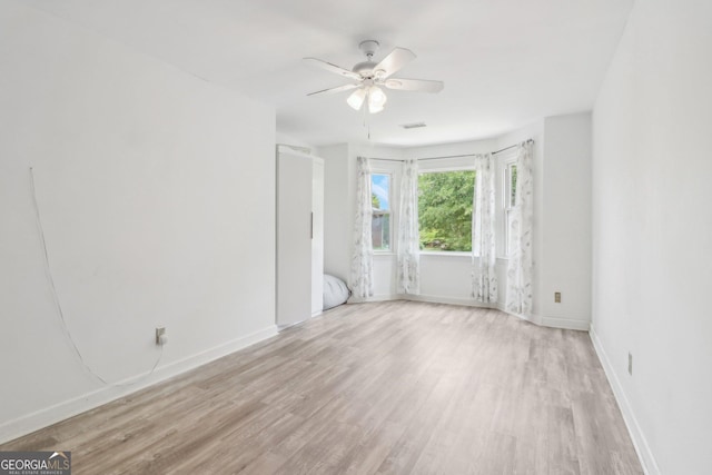771 James Cir, Lawrenceville, GA 30046 - unfurnished room with light wood finished floors, ceiling fan, and baseboards