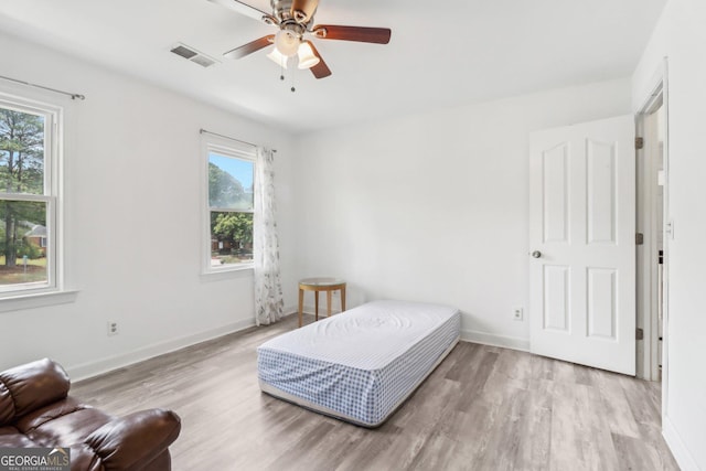771 James Cir, Lawrenceville, GA 30046 - bedroom featuring wood finished floors, baseboards, and a ceiling fan