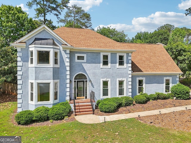 771 James Cir, Lawrenceville, GA 30046 - view of front of house featuring stucco siding and a shingled roof