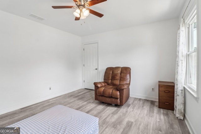 771 James Cir, Lawrenceville, GA 30046 - living area featuring light wood-type flooring, ceiling fan, and baseboards