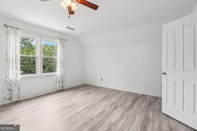 771 James Cir, Lawrenceville, GA 30046 - bonus room with lofted ceiling, ceiling fan, light wood-style flooring, and baseboards