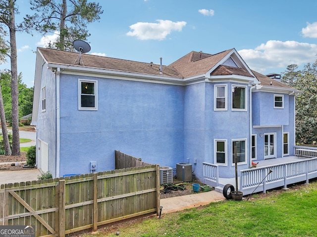 771 James Cir, Lawrenceville, GA 30046 - rear view of property with a deck, central air condition unit, and stucco siding