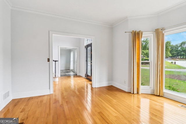 771 James Cir, Lawrenceville, GA 30046 - empty room with light wood-type flooring, crown molding, and baseboards