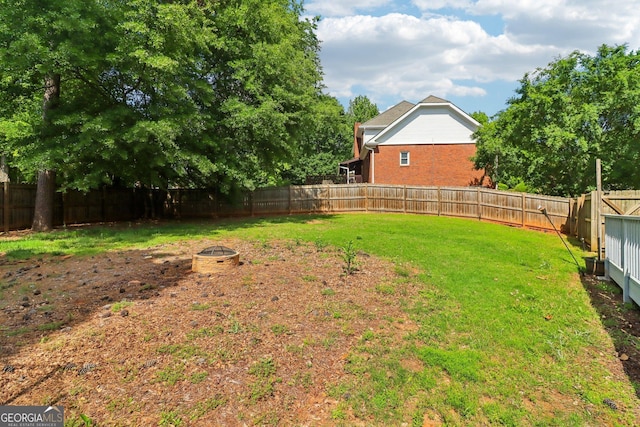 771 James Cir, Lawrenceville, GA 30046 - view of yard featuring a fire pit