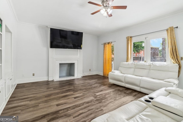 771 James Cir, Lawrenceville, GA 30046 - living room with ceiling fan, wood finished floors, crown molding, a fireplace, and baseboards