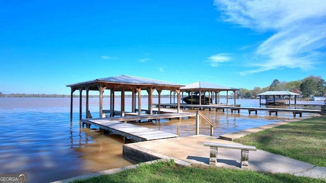 dock featuring boat lift and a water view