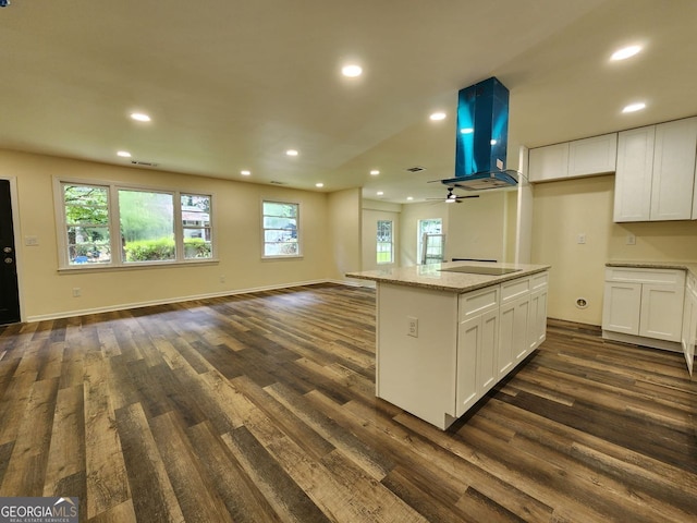 188 Oak Dr, Atlanta, GA 30354 - kitchen featuring open floor plan, ventilation hood, dark wood-type flooring, white cabinetry, and recessed lighting