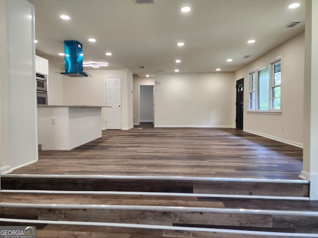 188 Oak Dr, Atlanta, GA 30354 - unfurnished living room featuring dark wood-style floors and recessed lighting