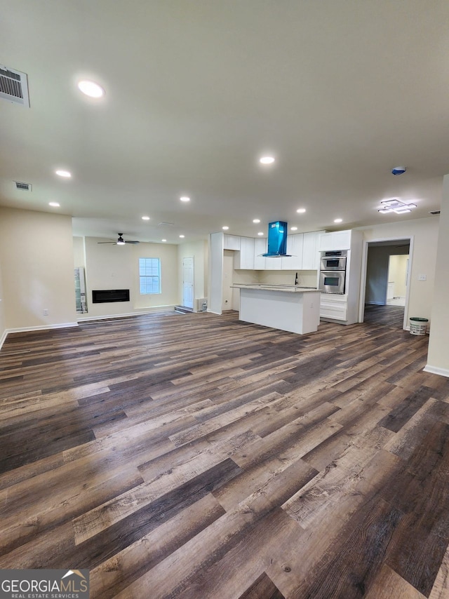 188 Oak Dr, Atlanta, GA 30354 - unfurnished living room featuring dark wood finished floors, recessed lighting, and ceiling fan