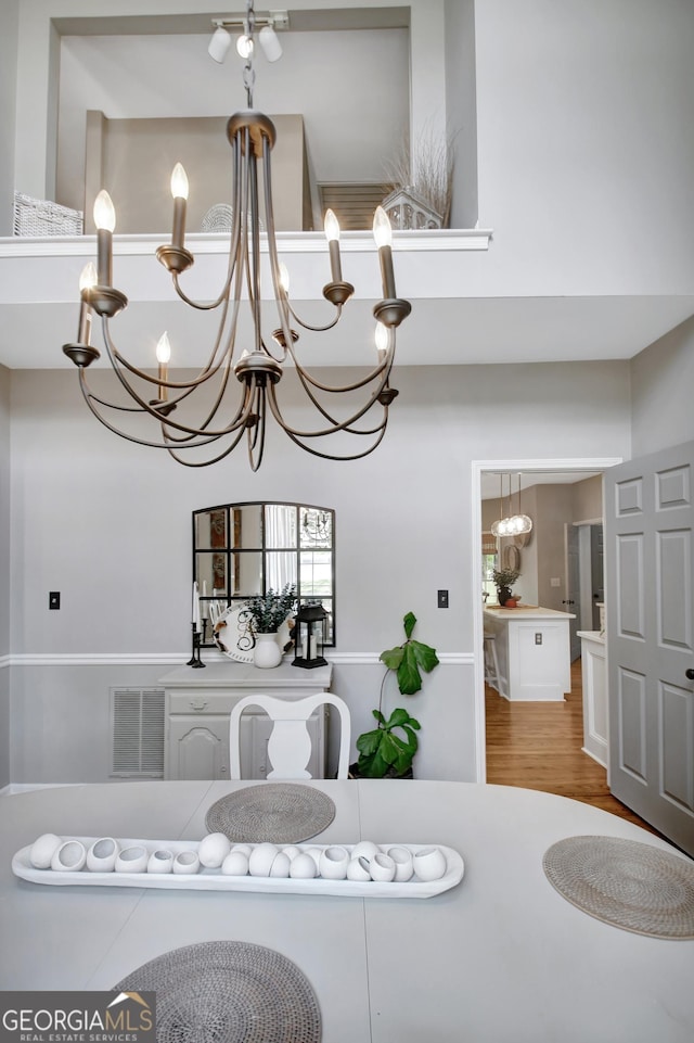 dining space featuring a chandelier and wood finished floors