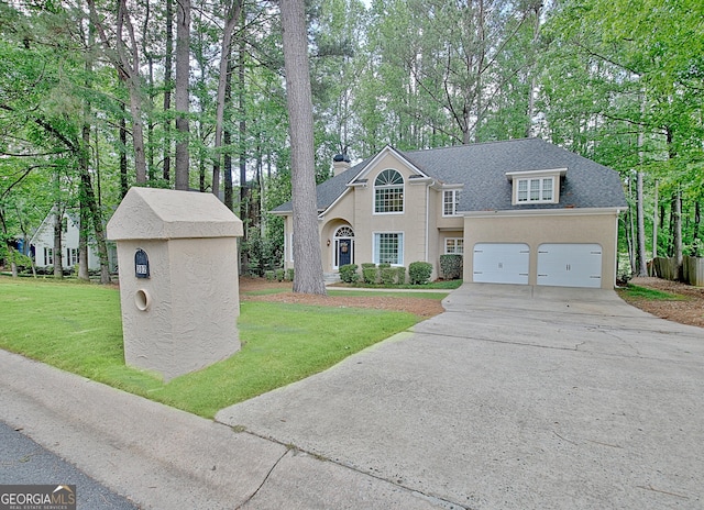 traditional home featuring driveway, a front lawn, and stucco siding