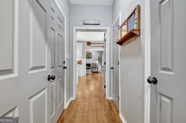 hallway with light wood-style floors