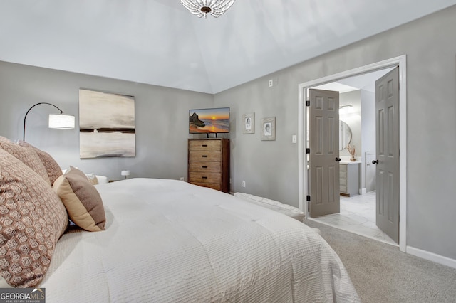 bedroom with marble finish floors, vaulted ceiling, and baseboards