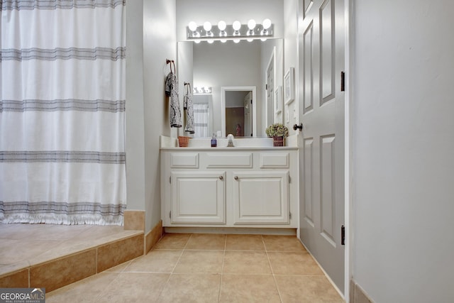 full bath featuring tile patterned floors, vanity, and a shower with shower curtain