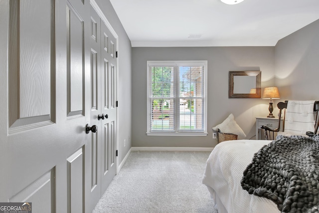 carpeted bedroom with baseboards