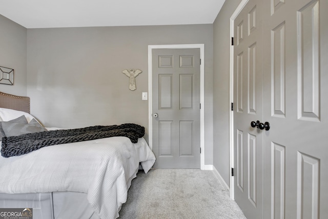 bedroom with carpet and baseboards