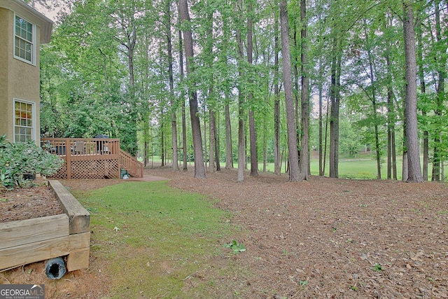 view of yard with a deck