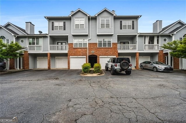508 Vinings Forest Ct SE, Smyrna, GA 30080 - multi unit property with an attached garage, driveway, and brick siding
