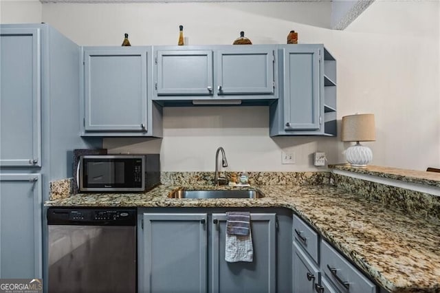 508 Vinings Forest Ct SE, Smyrna, GA 30080 - kitchen featuring stainless steel dishwasher, a sink, stone counters, open shelves, and a peninsula