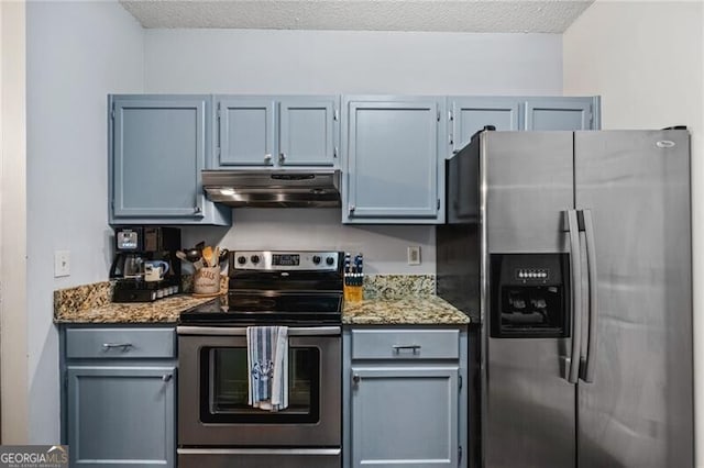 508 Vinings Forest Ct SE, Smyrna, GA 30080 - kitchen featuring stainless steel appliances, under cabinet range hood, light stone countertops, gray cabinetry, and a textured ceiling