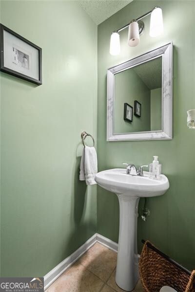 508 Vinings Forest Ct SE, Smyrna, GA 30080 - bathroom with baseboards, a textured ceiling, and tile patterned flooring